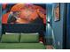 Bedroom with a parrot-themed mural and a plush bed at 3083 Mahalo Dr, Davenport, FL 33897