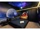 Bedroom with a space-themed mural and a king-size bed at 3083 Mahalo Dr, Davenport, FL 33897