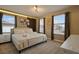 Bright bedroom with a king-size bed and neutral decor at 3083 Mahalo Dr, Davenport, FL 33897