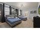 Guest bedroom with two twin beds, large windows, and tasteful decor at 3083 Mahalo Dr, Davenport, FL 33897