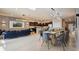 Open concept dining room with modern light fixtures and seating for many at 3083 Mahalo Dr, Davenport, FL 33897