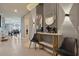 Elegant entryway with a marble console table and modern lighting at 3083 Mahalo Dr, Davenport, FL 33897