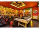 Super Mario themed game room with pool table and gaming chairs at 3083 Mahalo Dr, Davenport, FL 33897