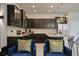 Modern kitchen with dark wood cabinets and granite countertops at 3083 Mahalo Dr, Davenport, FL 33897