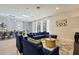 Elegant living room with a sectional sofa and gold accents at 3083 Mahalo Dr, Davenport, FL 33897