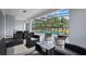 Relaxing screened-in pool and patio area with seating at 3083 Mahalo Dr, Davenport, FL 33897