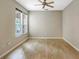 Bright bedroom with ceiling fan and hardwood floors at 3237 River Branch, Kissimmee, FL 34741