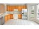 Kitchen with wood cabinets, stainless steel appliances, and tile floor at 3237 River Branch, Kissimmee, FL 34741