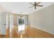 Bright living room with hardwood floors and access to the patio at 3237 River Branch, Kissimmee, FL 34741