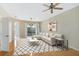 Bright living room with hardwood floors, white sofa, and sliding glass door at 3237 River Branch, Kissimmee, FL 34741