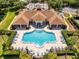 Community pool with surrounding lounge chairs at 3237 River Branch, Kissimmee, FL 34741