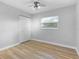 Grey bedroom with wood-look floors and ceiling fan at 328 E Hillcrest St, Altamonte Springs, FL 32701