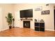 Living room featuring a fireplace, TV, and built-in shelving at 340 Forestway Cir # 208, Altamonte Springs, FL 32701