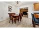 Bright dining room with wood table and chairs, view to living room at 349 Hickory Dr, Maitland, FL 32751