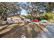 Side view of a single-story house with a large yard and trees at 349 Hickory Dr, Maitland, FL 32751