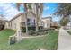 House exterior showcasing landscaping and a palm tree at 5530 Cypress Hill Rd, Winter Garden, FL 34787