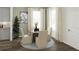 Small dining area with round table and four beige chairs at 5590 Stockade Blvd, St Cloud, FL 34771