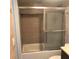 Bathroom tub and shower with glass enclosure at 6039 Village Cir # Bldg C, Orlando, FL 32822