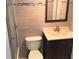 Updated bathroom with neutral tile and vanity at 6039 Village Cir # Bldg C, Orlando, FL 32822