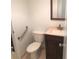 Clean bathroom with toilet, sink, and grab bar at 6039 Village Cir # Bldg C, Orlando, FL 32822