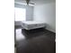 Bedroom with dark hardwood floors at 6039 Village Cir # Bldg C, Orlando, FL 32822