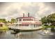 Unique boat-shaped community clubhouse on a pond at 6039 Village Cir # Bldg C, Orlando, FL 32822