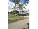 Landscaped grounds featuring a charming community building at 6039 Village Cir # Bldg C, Orlando, FL 32822