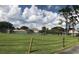 Expansive green space with tennis courts and community building at 6039 Village Cir # Bldg C, Orlando, FL 32822