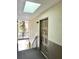 Well-lit condo entryway with ornate door and skylight at 6039 Village Cir # Bldg C, Orlando, FL 32822