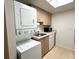 Small kitchen with stackable washer and dryer at 6039 Village Cir # Bldg C, Orlando, FL 32822
