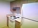 Kitchen with light brown cabinets and white appliances at 6039 Village Cir # Bldg C, Orlando, FL 32822