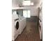 On-site laundry facility with several washers and dryers at 6039 Village Cir # Bldg C, Orlando, FL 32822