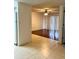 View of living room with wood floors from kitchen at 6039 Village Cir # Bldg C, Orlando, FL 32822