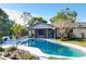 Enjoy this kidney-shaped pool with patio and screened porch at 615 Osage Ct, Winter Springs, FL 32708