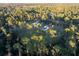 Aerial view of a house with a large lot and lush green surroundings at 720 Napoli Ln, New Smyrna Beach, FL 32168