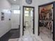 Bathroom with walk-in shower, toilet, and access to a large closet at 720 Napoli Ln, New Smyrna Beach, FL 32168
