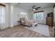 Bright bedroom with neutral decor and large windows at 720 Napoli Ln, New Smyrna Beach, FL 32168