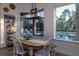 Breakfast nook with wooden table and view of the pool at 720 Napoli Ln, New Smyrna Beach, FL 32168
