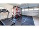 Home gym with a squat rack, treadmill, and plenty of floor space at 720 Napoli Ln, New Smyrna Beach, FL 32168
