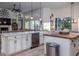 Open concept kitchen with island and stainless steel appliances at 720 Napoli Ln, New Smyrna Beach, FL 32168