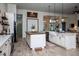 Spacious kitchen with island, white cabinets, and farmhouse sink at 720 Napoli Ln, New Smyrna Beach, FL 32168
