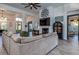 Open living space with large sectional sofa and fireplace at 720 Napoli Ln, New Smyrna Beach, FL 32168