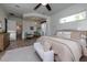 Spacious main bedroom with large bed, ensuite bathroom access, and plenty of natural light at 720 Napoli Ln, New Smyrna Beach, FL 32168