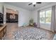 Playroom with view into home office, hardwood floors, and built-in shelving at 720 Napoli Ln, New Smyrna Beach, FL 32168