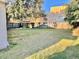 Large grassy backyard with a wooden fence at 770 Carver St, Winter Park, FL 32789