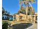 Tan single-story house with a yard and palm tree at 770 Carver St, Winter Park, FL 32789