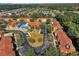 Community overview featuring homes, pool, and landscaping at 1005 Park Ridge Cir, Kissimmee, FL 34746