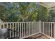 Private balcony with wooded views and wicker chair at 1005 Park Ridge Cir, Kissimmee, FL 34746