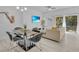 Bright dining area with glass table, metal chairs, and modern decor at 1005 Park Ridge Cir, Kissimmee, FL 34746