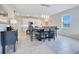 Bright dining area with table and chairs, adjacent to kitchen at 11006 Silver Surfer Aly, Winter Garden, FL 34787